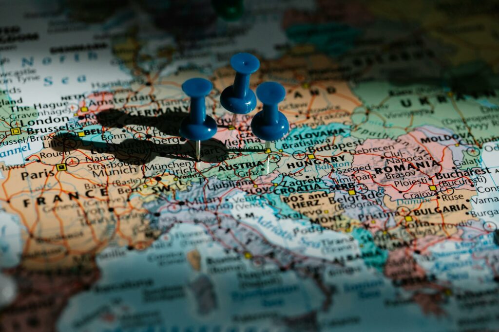 blue pushpins on administrative map of europe